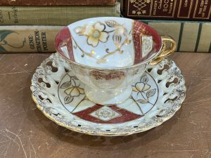 Beautiful Golden Flowers with Burgundy Design with Lattice Edging on Saucer